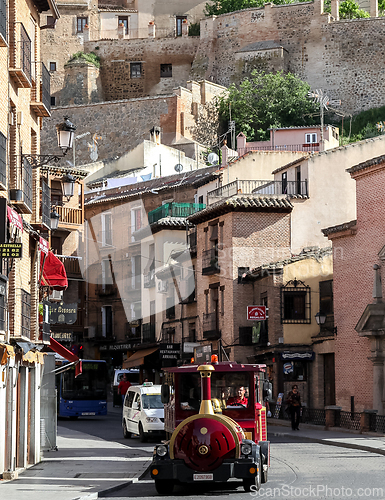 Image of TOLEDO, SPAIN - MAY 06, 2015 - Tourist train on a street