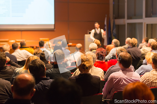 Image of Speaker at Business Conference and Presentation.