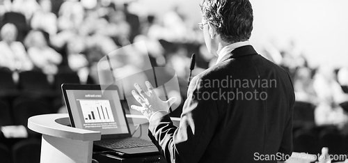 Image of Speaker at Business Conference and Presentation.