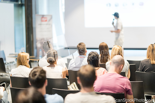 Image of Male business speaker giving a talk at business conference event.