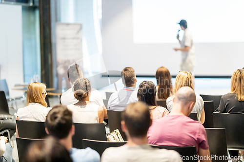 Image of Male business speaker giving a talk at business conference event.