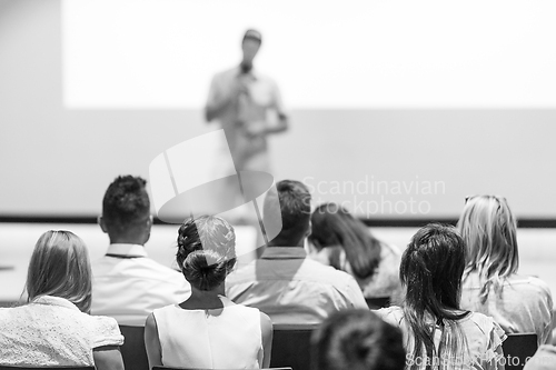 Image of Male business speaker giving a talk at business conference event.