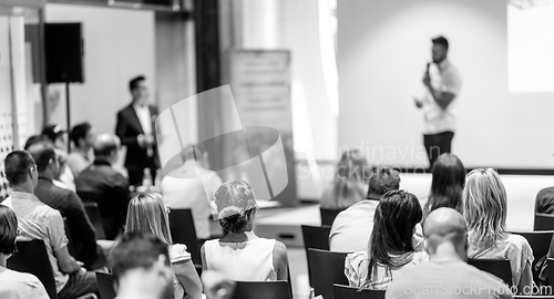 Image of Male business speaker giving a talk at business conference event.