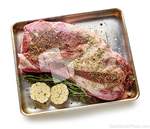 Image of fresh raw pork neck meat with garlic and spices