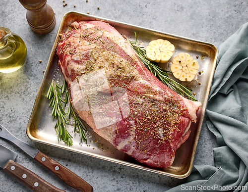 Image of fresh raw pork neck meat with garlic and spices