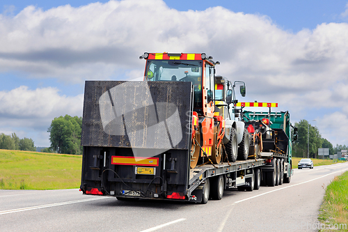 Image of Truck Transports Roadworks Machinery, Rear View