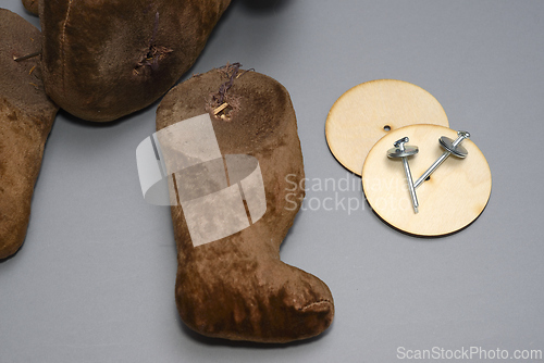 Image of broken toy teddy beer with severed paws 