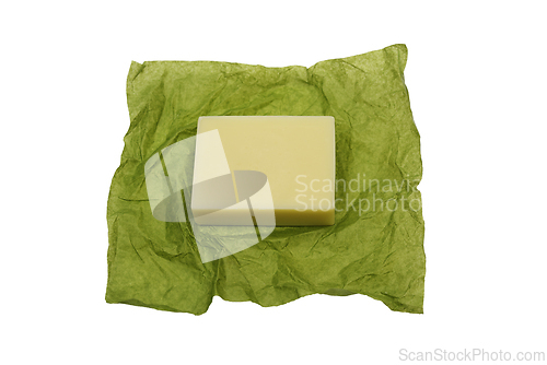 Image of bar of soap on green paper wrapper