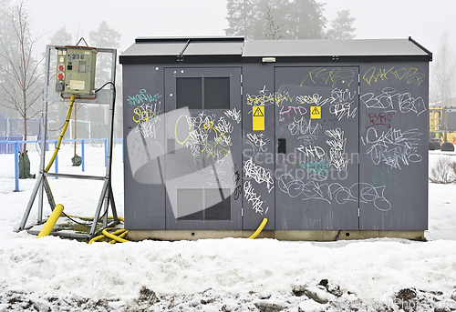 Image of Graffiti covered electrical box in winter