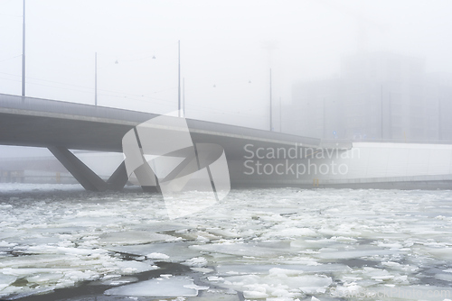 Image of concrete bridge in heavy fog in early spring 