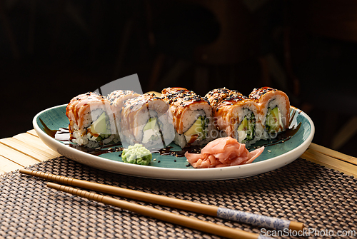 Image of Sushi rolls with salmon, avocado