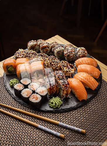 Image of Assorted sushi arranged on a slate platter