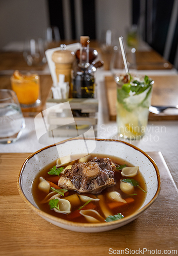 Image of Hot oxtail soup served with carrots