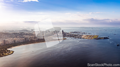 Image of Golden Hour panorama of Guanabara Bay with the distinct shape of Santos Dumont Airport. Rio de Janeiro, Brazil.