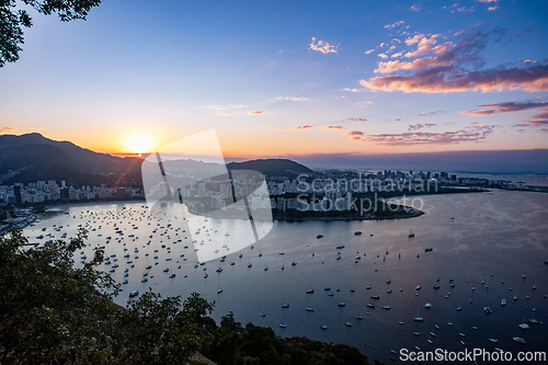 Image of Golden Hour panorama of Guanabara Bay with the distinct shape of Santos Dumont Airport. Rio de Janeiro, Brazil.