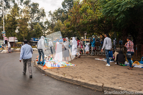 Image of Pedestrians and vendors on a busy city street in Addis Ababa, Ethiopia