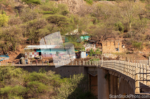 Image of Houses with corrugated iron roofs built into the steep terrain near the Blue Nile River Bridge. Amhara Region, Ethiopia