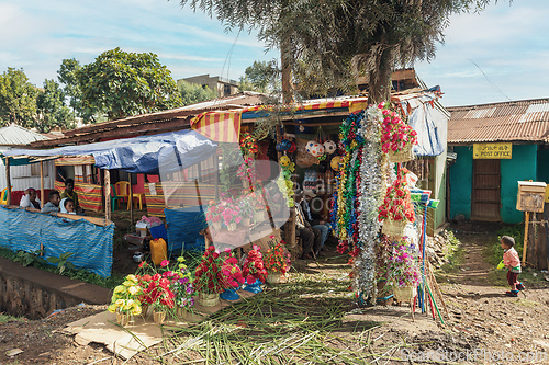 Image of Street market stall selling colorful artificial flowers and decorations in the town of Dembecha. Ethiopia