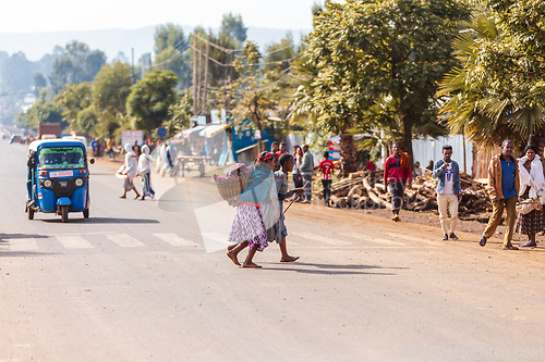 Image of Pedestrian traffic and daily activity on a main road in the Ethiopian town of Demebecha. Ethiopia