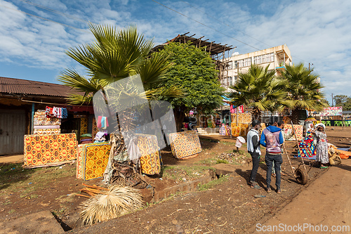 Image of Bustling roadside marketplace in Demebecha, where people shop and socialize among the goods. Ethiopia