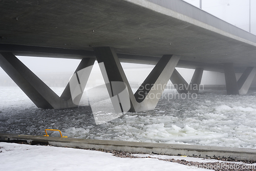 Image of concrete bridge in heavy fog in early spring 