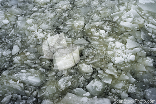 Image of melting ice on the surface of the water 