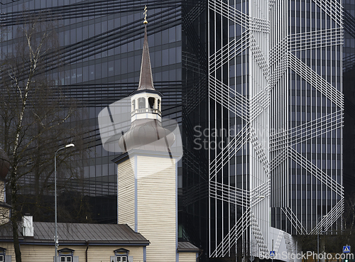 Image of church against the backdrop of a modern office building 