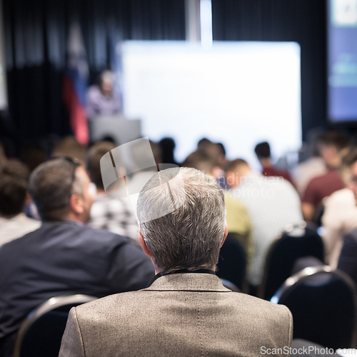 Image of Business speaker giving a talk at business conference event.