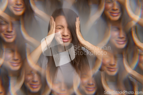 Image of Stressed woman with eyes closed pressing temples showing migraine or headache