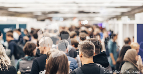 Image of Abstract blurred people at exhibition hall of expo event trade show. Business convention show or job fair. Business concept background.