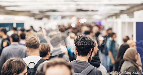 Image of Abstract blurred people at exhibition hall of expo event trade show. Business convention show or job fair. Business concept background.