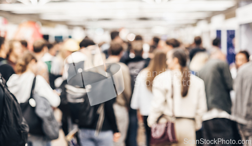 Image of Abstract blurred people at exhibition hall of expo event trade show. Business convention show or job fair. Business concept background.