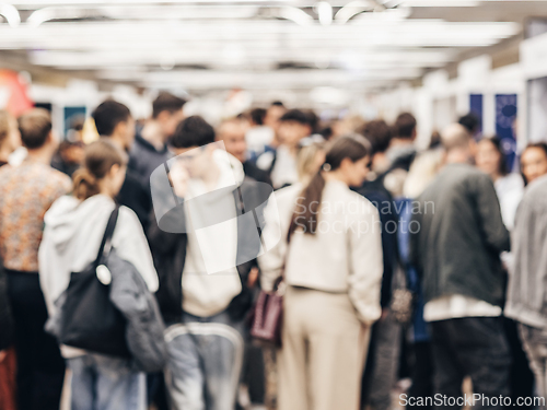 Image of Abstract blurred people at exhibition hall of expo event trade show. Business convention show or job fair. Business concept background.