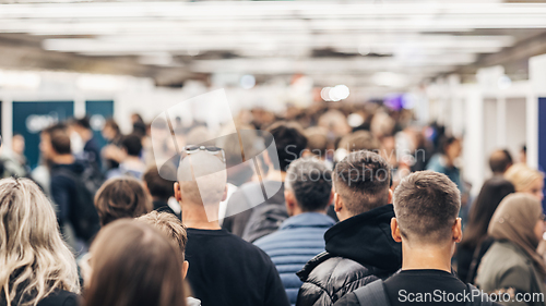 Image of Abstract blurred people at exhibition hall of expo event trade show. Business convention show or job fair. Business concept background.