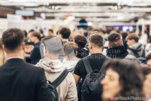 Image of Abstract blurred people at exhibition hall of expo event trade show. Business convention show or job fair. Business concept background.