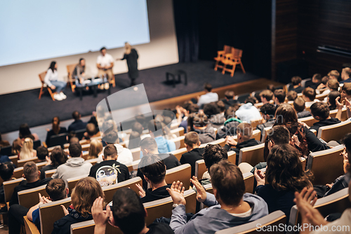 Image of Interview and round table discussion at business convention and presentation. Audience at the conference hall. Business and entrepreneurship symposium