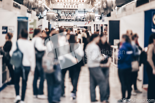 Image of Abstract blurred people at exhibition hall of expo event trade show. Business convention show or job fair. Business concept background.