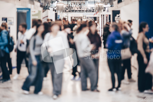 Image of Abstract blurred people at exhibition hall of expo event trade show. Business convention show or job fair. Business concept background.