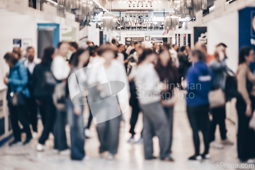 Image of Abstract blurred people at exhibition hall of expo event trade show. Business convention show or job fair. Business concept background.