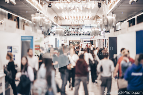 Image of Abstract blurred people at exhibition hall of expo event trade show. Business convention show or job fair. Business concept background.