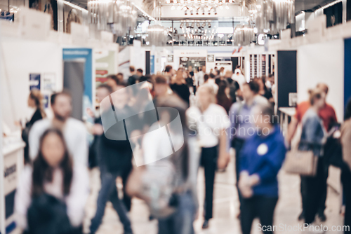 Image of Abstract blurred people at exhibition hall of expo event trade show. Business convention show or job fair. Business concept background.