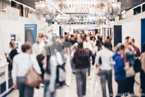 Image of Abstract blurred people at exhibition hall of expo event trade show. Business convention show or job fair. Business concept background.