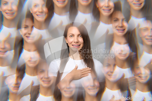 Image of Creative optical illusion portrait of woman with multiple reflections holding hand on chest smiling