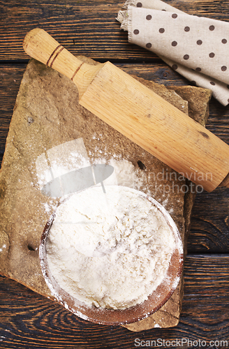 Image of Close up of bowl of flour on wooden table