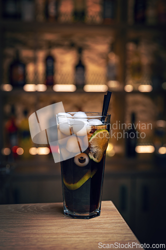Image of Refreshing halloween cocktail featuring a spooky eyeball and ice