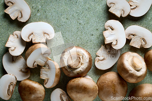 Image of fresh mushrooms on green background
