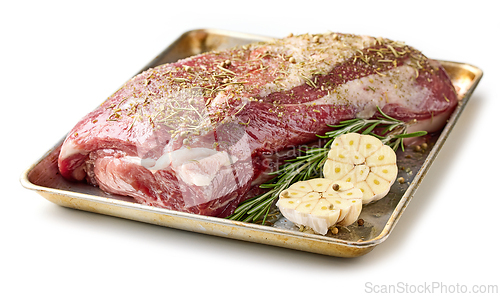 Image of fresh raw pork neck meat with garlic and spices 