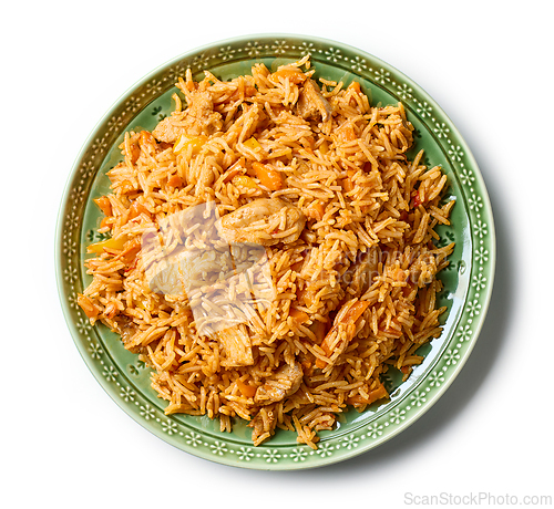 Image of rice with chicken meat and vegetables on green plate