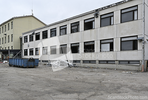 Image of demolition of an old concrete school building  