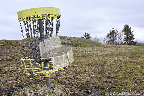 Image of  golf frisbee basket  in early spring 